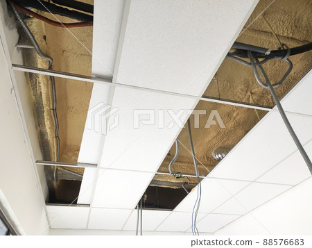SELANGOR, MALAYSIA - MARCH 10, 2022: Polyurethane insulating foam that has been sprayed and covered the surface below the concrete slabs. Serves as a layer of thermal insulation for the building. SELANGOR, MALAYSIA - MARCH 10, 2022: Polyurethane insulating foam that has been sprayed and covered the surface below the concrete slabs. Serves as a layer of thermal insulation for the building. 88576683