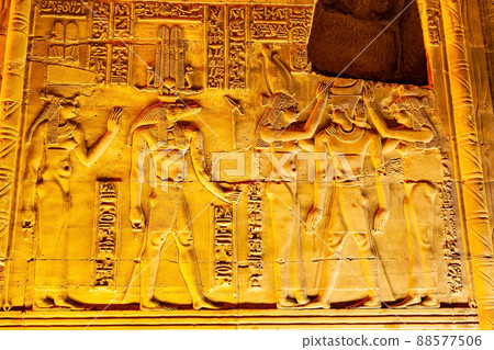 Relief and hieroglyphs at the wall of The Temple Of Sobek and Horus at Kom Ombo in the night. 88577506