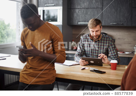 young man using a digital tablet in a coworking center. young man using a digital tablet in a coworking center. 88577839
