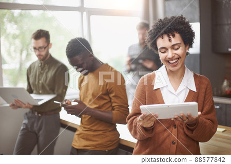 young business woman with a digital tablet standing in the hall 88577842