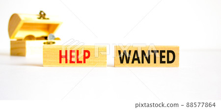 Help wanted and support symbol. Concept words Help wanted on wooden blocks on a beautiful white table white background. Wooden chest with coins. Business support and help wanted concept, copy space. 88577864