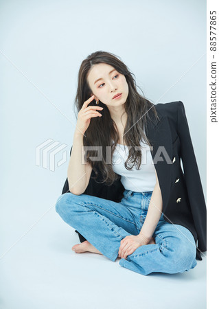 Fashion young woman in a shoulder jacket 88577865