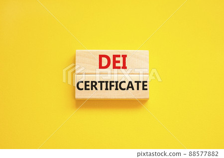 DEI diversity equity inclusion certificate symbol. Blocks with words DEI certificate on beautiful yellow background. Business DEI diversity equity inclusion certificate concept. Copy space. 88577882