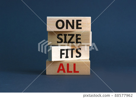 One size fits all symbol. Concept words One size fits all on wooden blocks. Beautiful grey table grey background. One size fits all business concept. Copy space. 88577962
