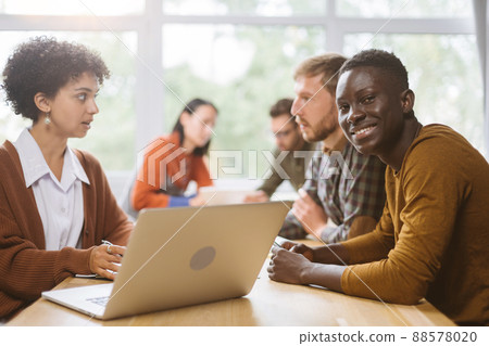 business woman communicates with a client sitting at a table in business woman communicates with a client sitting at a table in 88578020