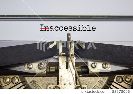 Inaccessible or accessible symbol. Changed the concept word 'Inaccessible' to 'Accessible' typed on old retro typewriter. Diversity, inclusion and inaccessible or accessible concept. Copy space. 88578096