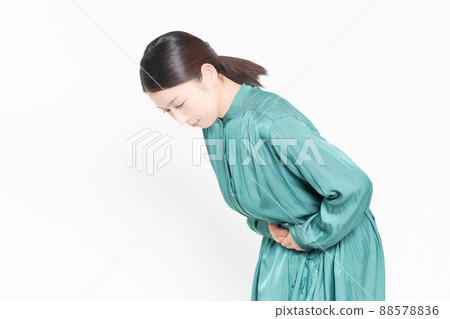 Housewife putting her hand on her stomach Housewife putting her hand on her stomach 88578836