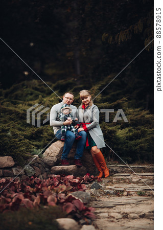 Beautiful and happy family with little child in 88578915