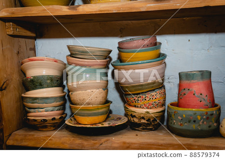 Hand made ceramic tableware, Collection of colorful clay pottery ceramics. 88579374