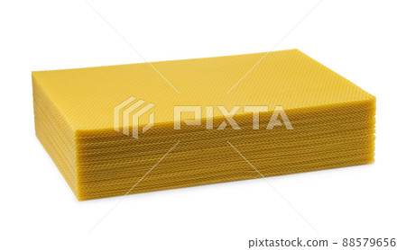 Beeswax. Wax base for honey bee rebuilding on a white background. Honeycombs. 88579656
