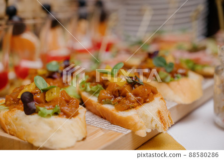 Sandwich with ham, cheese, tomatoes, lettuce and toasted bread. Sandwich with ham, cheese, tomatoes, lettuce and toasted bread. 88580286