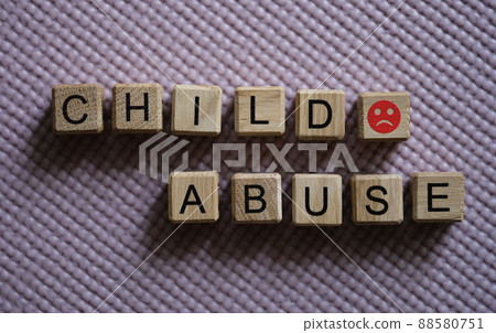 Text abuse child angry emoticon on cubes closeup 88580751
