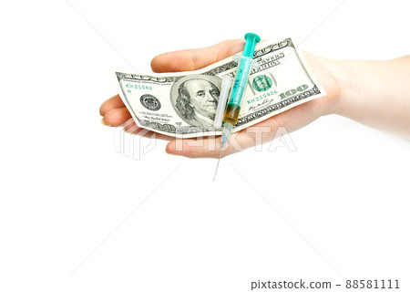 Money and pills with drugs and a syringe on isolated on white 88581111