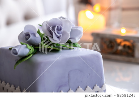 Beautiful decorated fruit cake with blue roses Beautiful decorated fruit cake with blue roses 88581245