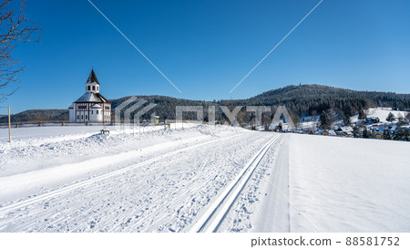 Wooden evangelic chapel in Tesarov in wintertime 88581752