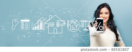 Real estate theme with woman holding a smartphone Real estate theme with woman holding a smartphone 88581807