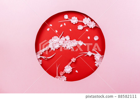 Spring papercraft composition with sakura branch on pink and red 88582111