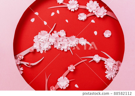 Spring papercraft composition with sakura branch on pink and red 88582112