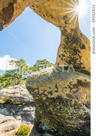 Unique sandstone arch on sunny summer day 88582621