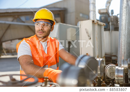 Industrial worker on his job at construction plant Industrial worker on his job at construction plant 88583807