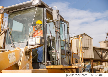 Manual worker driving cargo truck in plant Manual worker driving cargo truck in plant 88583810