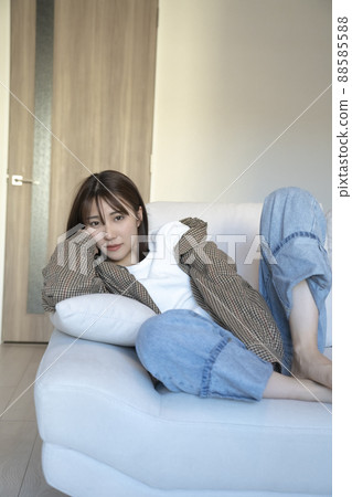 Men's fashion A woman relaxing on the sofa Men's fashion A woman relaxing on the sofa 88585588