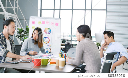 Group of business people meeting in conference room. Asian businessman speech, present teamwork partnership. Happy business people meeting present graph chart investment, business data in meeting room 88587058