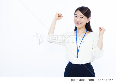Business woman in her thirties doing a guts pose Business woman in her thirties doing a guts pose 88587267