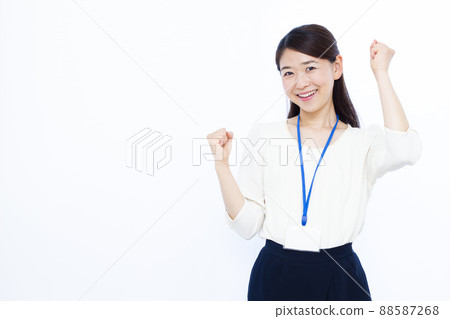Business woman in her thirties doing a guts pose Business woman in her thirties doing a guts pose 88587268