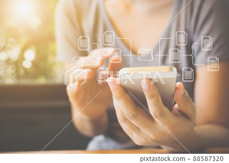 Woman using mobile smartphone. Document management system (DMS) 88587320