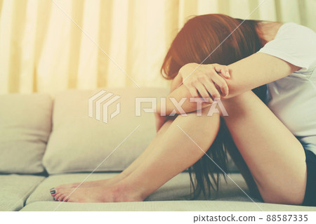 A woman sitting stressed, depressed, insomnia who broke up with her boyfriend. A woman sitting stressed, depressed, insomnia who broke up with her boyfriend. 88587335