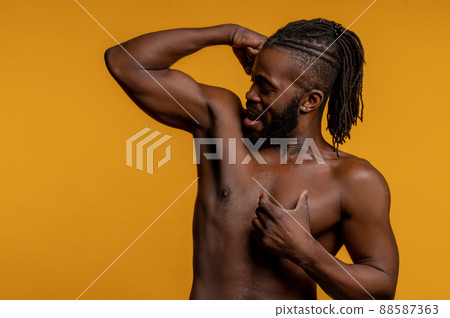 Athlete showing off his arm strength during the photo shoot 88587363