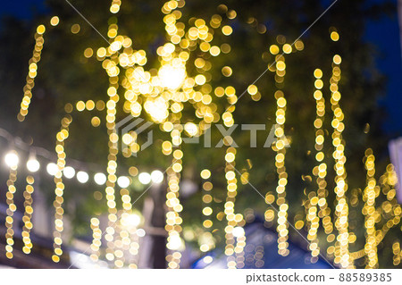 Blur Image Decorative outdoor string lights hanging on tree in the garden at night time 88589385