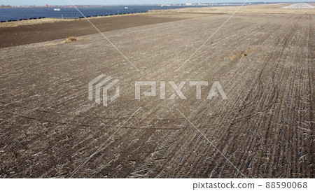 Aerial Drone View Flight Over field of plowed brown earth. Plowed fields. Aerial Drone View Flight Over field of plowed brown earth. Plowed fields. 88590068