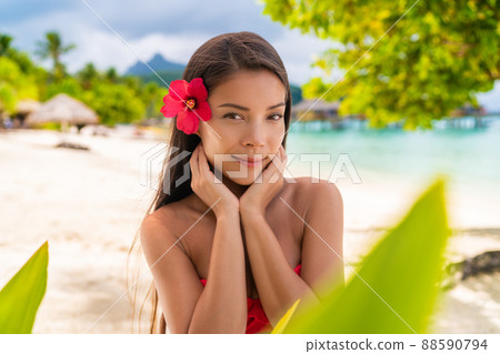 Spa Asian natural beauty woman wellness skin care touching face looking at camera serene outside. Beautiful skincare concept with mixed race model girl 88590794