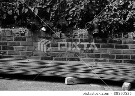 Black and white photo of rebars prepared for construction site lying on the ground Black and white photo of rebars prepared for construction site lying on the ground 88593525