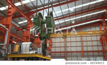 Closeup of swivel chain hook crane of electric hoist in factory workshop 88594651