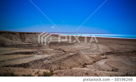 Panorama view to saline Barsa Kelmes lake and Ustyurt plateau in Karakalpakstan, Uzbekistan Panorama view to saline Barsa Kelmes lake and Ustyurt plateau in Karakalpakstan, Uzbekistan 88596266