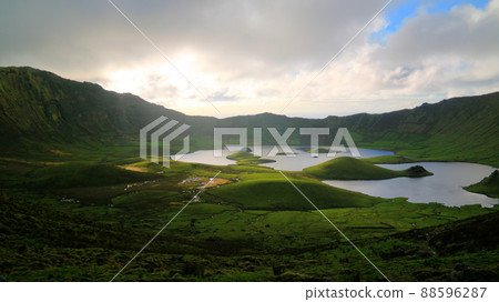 Landscape sunset view to Caldeirao crater, Corvo island, Azores, Portugal Landscape sunset view to Caldeirao crater, Corvo island, Azores, Portugal 88596287