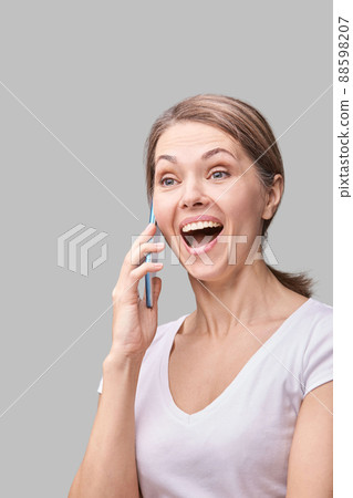 Pretty female portrait. Woman talking by mobile phone. Cute conversation concept 88598207
