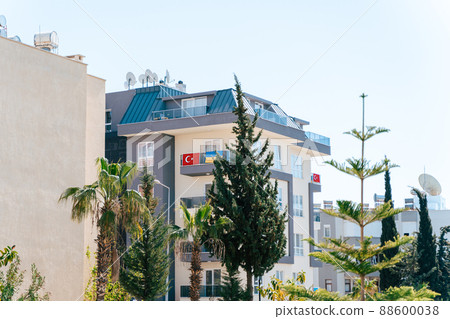 Ukraine and Turkey national flags hanging from residential building balcony. Stand with Ukraine, stop war. Ukrainian community abroad. international support concept 88600038