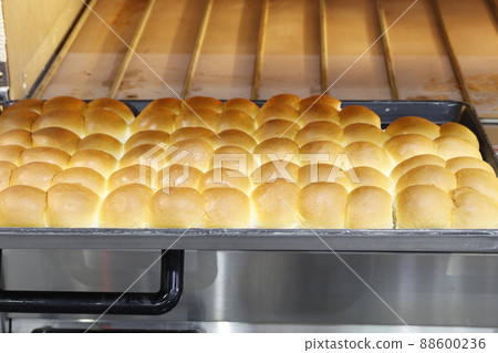 Row of fresh  baking bread from the oven 88600236