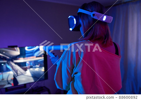 Woman with virtual reality headset are playing game and fighting. Woman with virtual reality headset are playing game and fighting. 88600892