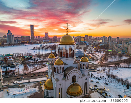 Winter Yekaterinburg and Temple on Blood in beautiful pink and orange sunset. Translation of the text on the temple 88600995
