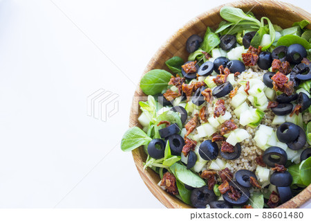 Quinoa, lettuce, lambs lettuce, black olives and cucumber salad 88601480