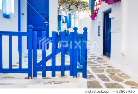 The island of Mykonos, Greece. Streets and traditional architecture. Entrance to a private home.  88602480