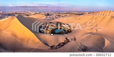 Aerial sunset view of the Huacachina Oasis in the Atacama desert of Peru Aerial sunset view of the Huacachina Oasis in the Atacama desert of Peru 88602712