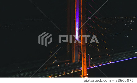 Night city minimal landscape.Dark tranquil long exposure photography with led illuminated bridge and light reflections 88603075