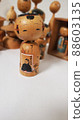 A cute traditional kokeshi doll with an old and rare picture 88603135