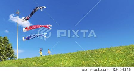 An energetic child running along the road along the bank where carp streamers swim comfortably / Children's Day, Dragon Boat Festival, and a refreshing holiday 88604346